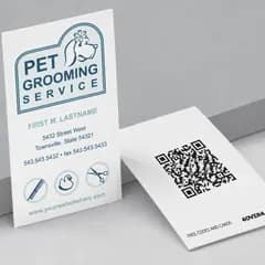 Pet grooming free business card front standing beside its QR code back